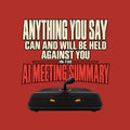 Black tee art on dark background: bold text reads ANYTHING YOU SAY CAN AND WILL BE HELD AGAINST YOU IN THE AI MEETING SUMMARY, the last line in red, above a black tabletop speaker with two amber lights and a microphone stem ringed in red. Artwork shown on the Red garment colour.