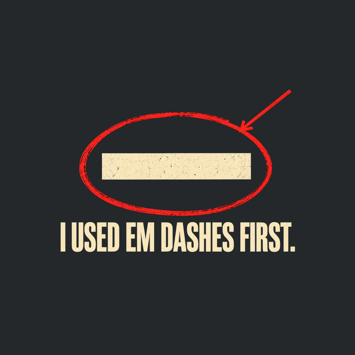 Navy artwork showing a cream em dash circled in red ink with a red leader line pointing to it, above bold cream uppercase text reading I USED EM DASHES FIRST. Artwork shown on the Black garment colour.