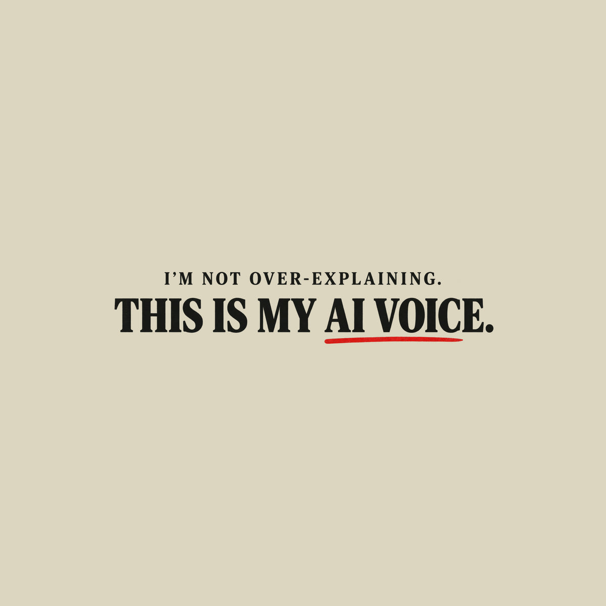 Black tee with cream text reading I'M NOT OVER-EXPLAINING. above larger bold text THIS IS MY AI VOICE. with a muted red underline beneath AI VOICE. Artwork shown on the Natural garment colour.