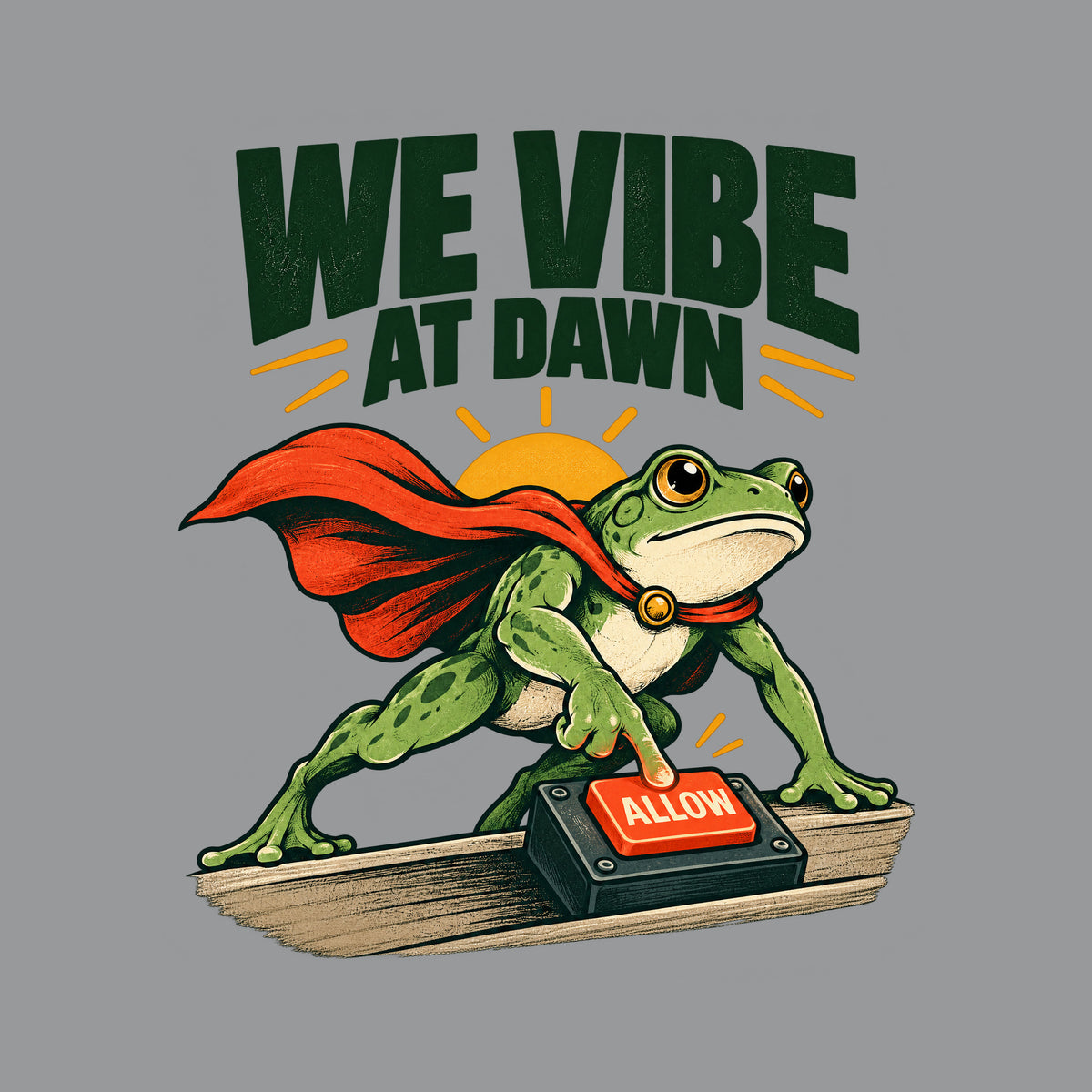 Illustration of a green frog in a red cape pressing a glowing red "ALLOW" button on a small desktop controller, with a rising sun behind it and the bold headline "WE VIBE AT DAWN" above, on a plain cream background. Artwork shown on the Sport Grey garment colour.