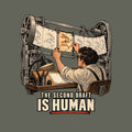 A machine feeds a strip of pale, identical rabbit-frames. An animator slides in one vivid orange keyframe of the same rabbit, alive with expression. Below: THE SECOND DRAFT (small), IS HUMAN (large), underlined in vermilion. Artwork shown on the Military Green garment colour.