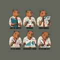 Six-panel comic of one tired capybara office worker, captioned ADD THE CONTEXT, REPHRASE, CHECK SOURCES, FIX THE ANSWER, EXPLAIN WHAT IT MEANT, PUT MY NAME ON IT, each holding a matching folder, page, or chart. Artwork shown on the Military Green garment colour.